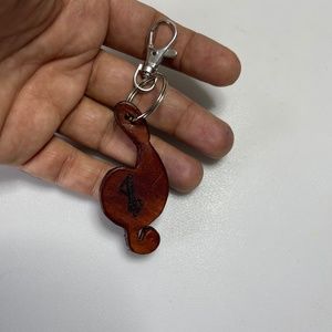 A twelve centimeters brown treble clef keychain